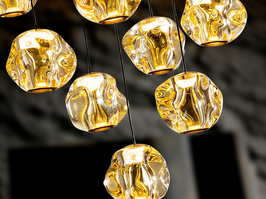 Schuller Zaria 13-light chandelier, black/bronze/amber, D60, dim, 502344