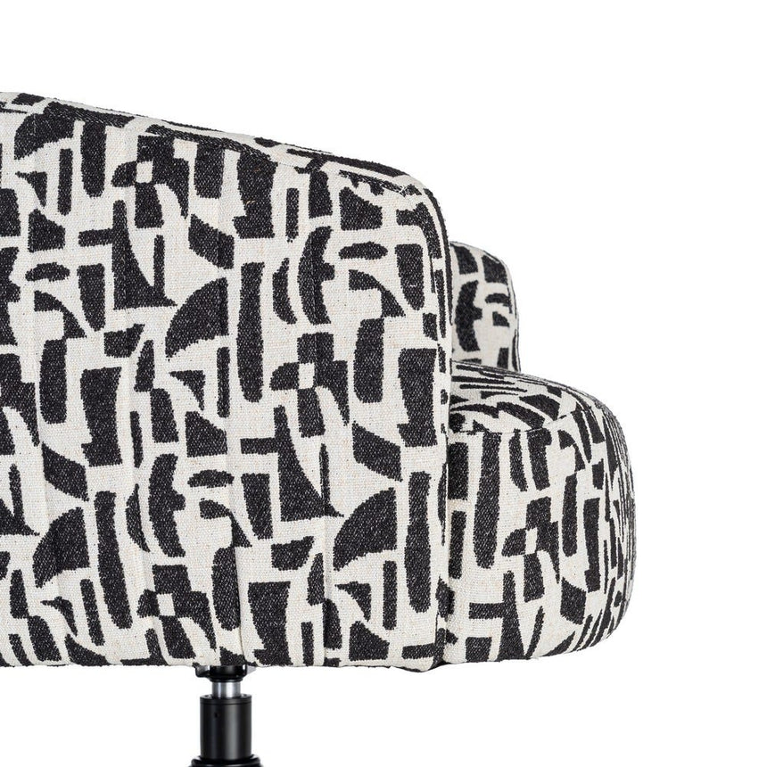Sillón giratorio IXIA 616830 negro y blanco, detalle lateral del asiento y unión con la base