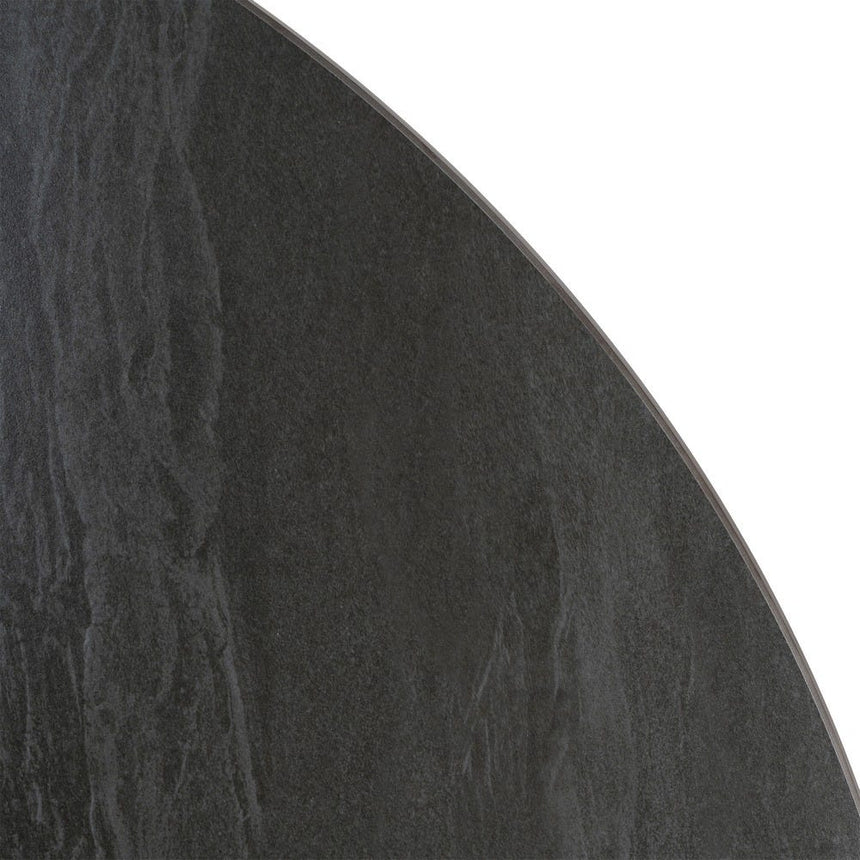 Mesa de comedor de piedra sinterizada negra de 120 cm, detalle de la textura de la piedra