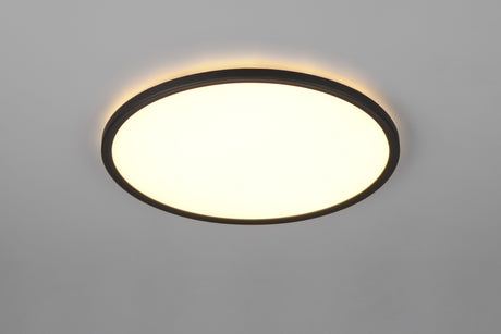Plafón de techo Trio Joko LED CCT en negro instalado en un dormitorio