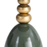 Detalle del pie dorado con formas esféricas y la base verde de IXIA 616772