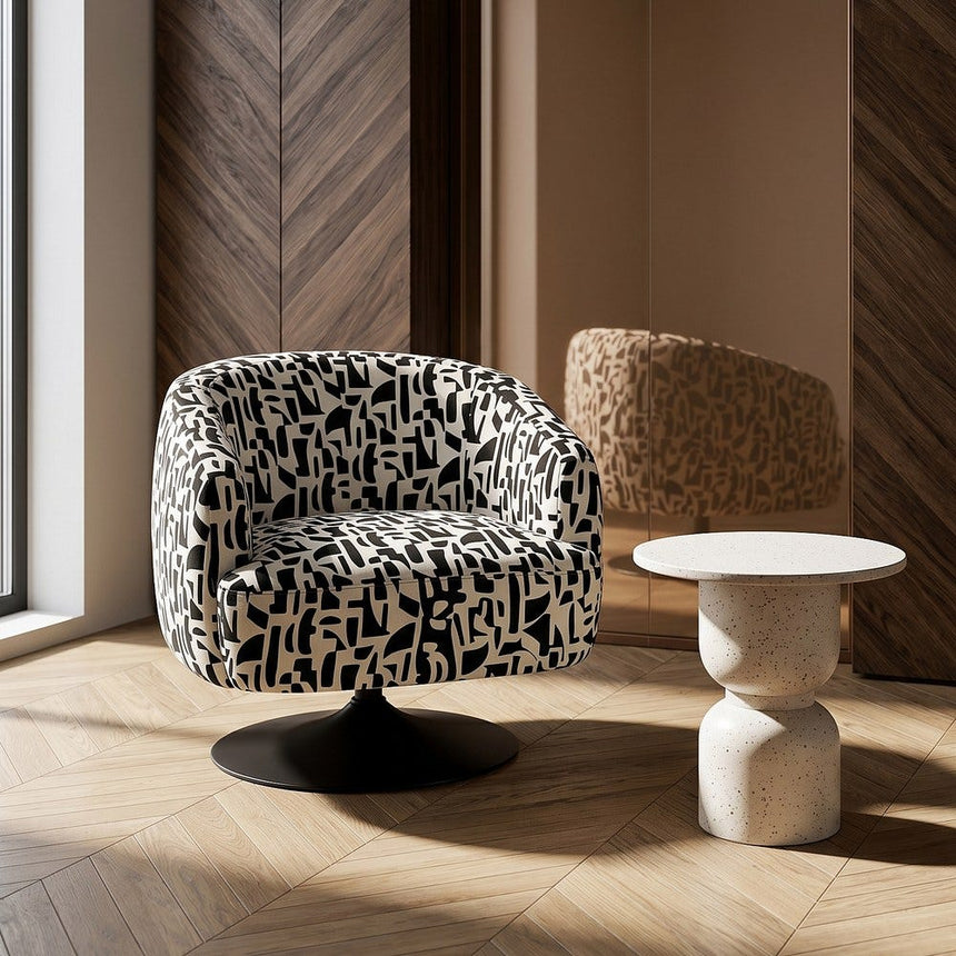 Sillón giratorio IXIA 616830 negro y blanco, vista completa en ambiente junto a un ventanal