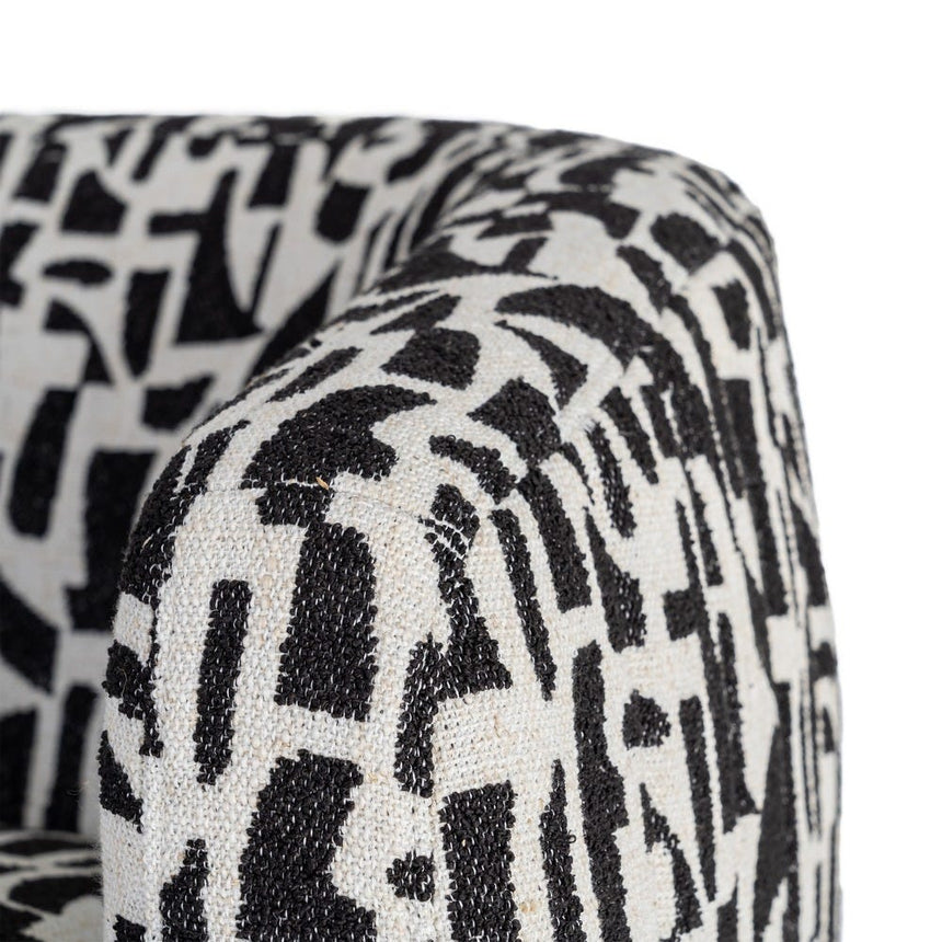 Sillón giratorio IXIA 616830 negro y blanco, detalle del tapizado superior del brazo