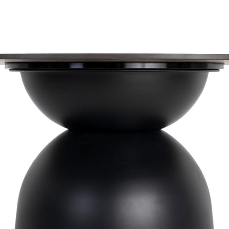 Mesa de comedor de piedra sinterizada negra de 120 cm, detalle de la unión con la base