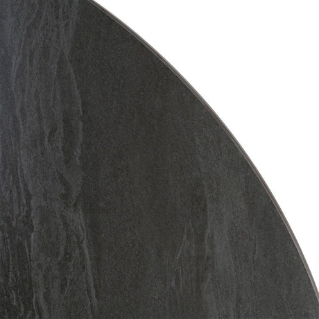 Mesa de comedor de piedra sinterizada negra de 120 cm, detalle de la textura de la piedra