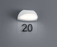 Aplique de exterior Trio Muga 228360101 blanco, iluminado sobre pared con placa transparente para numeración
